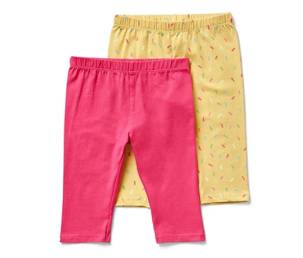 Deux leggings ¾ pour enfant, un rose et un jaune avec des motifs de confettis colorés.