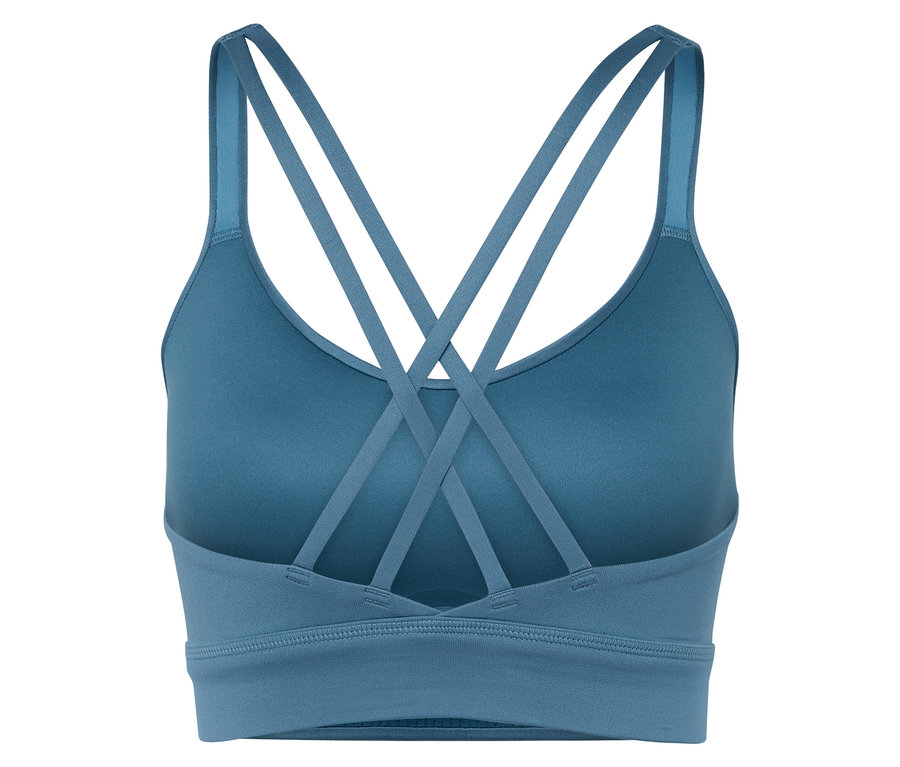 Gros plan d'un soutien-gorge de sport bleu avec des bretelles croisées dans le dos.
