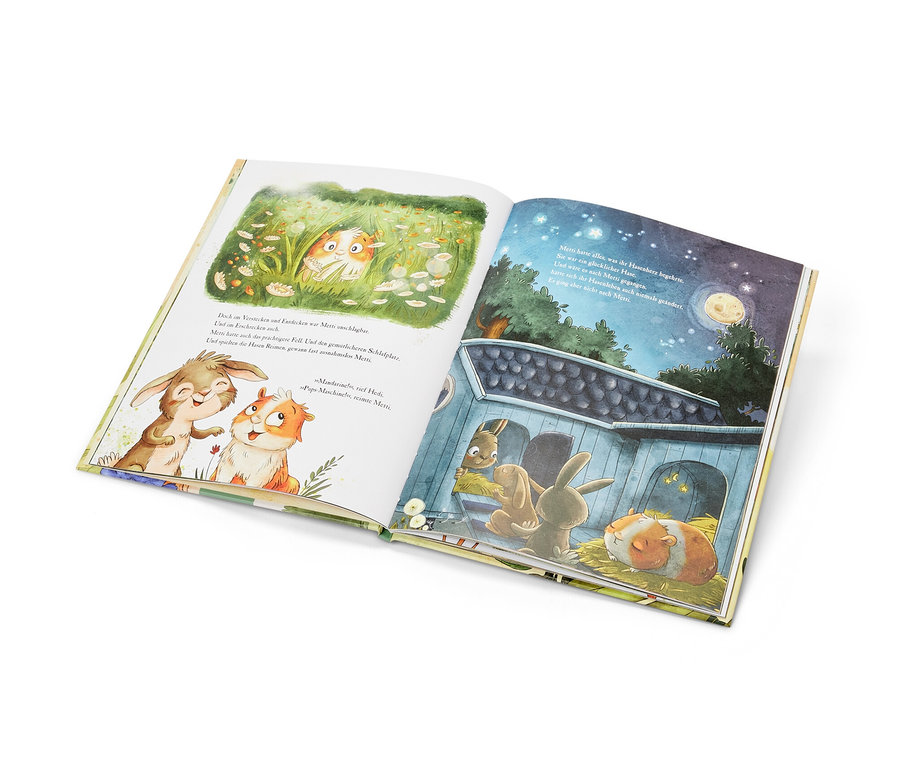 Livre ouvert avec illustrations d'un lapin et d'un cochon d'Inde, produit est « Metti, le cochon d’Inde » (en allemand).