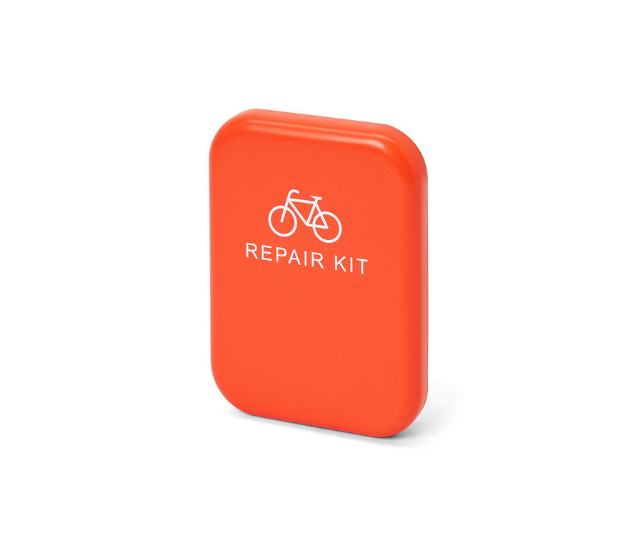 Kit de réparation de vélo orange avec une image de vélo.