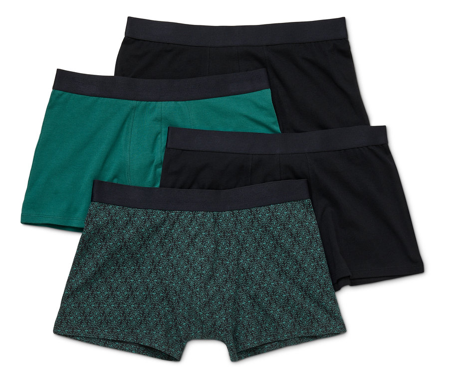Vue de dessus de quatre boxers pour hommes en noir, vert et à motifs.