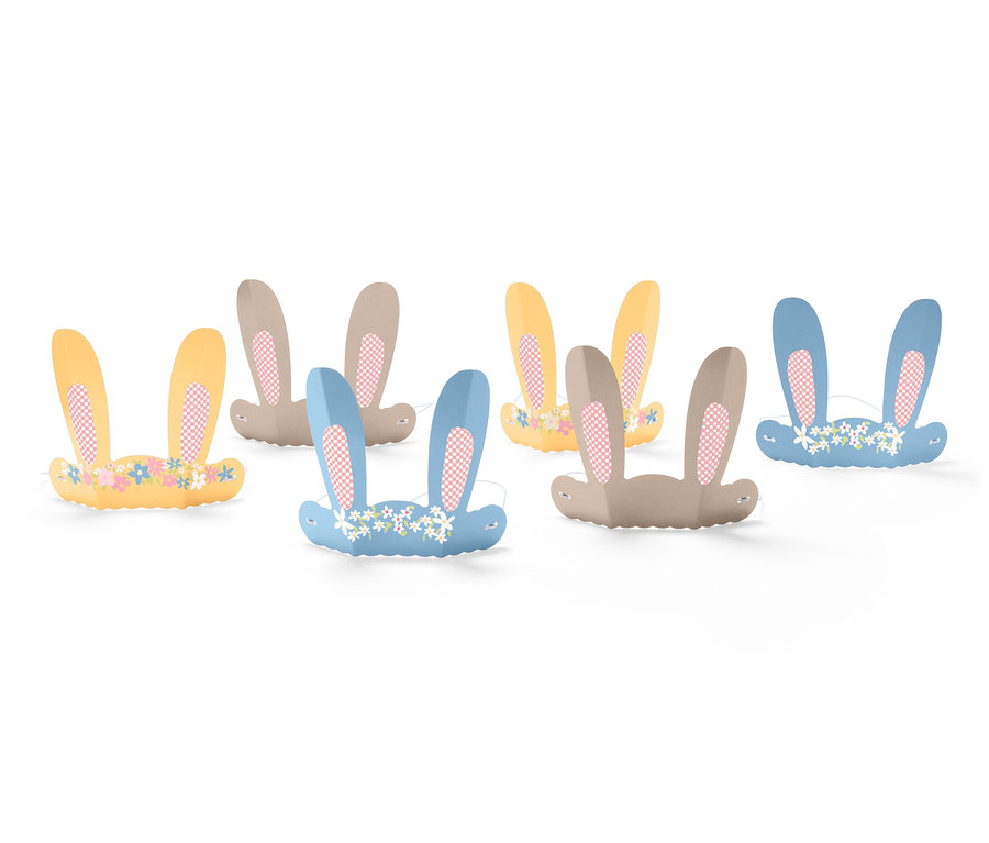 Six oreilles de lapin en papier de différentes couleurs avec des motifs floraux.