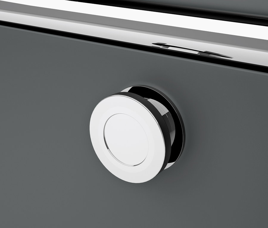 Détail d'une commode en métal gris « CN3 » à 4 abattants avec une poignée ronde chromée.