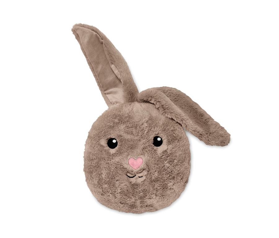 Un coussin en peluche petit lapin.