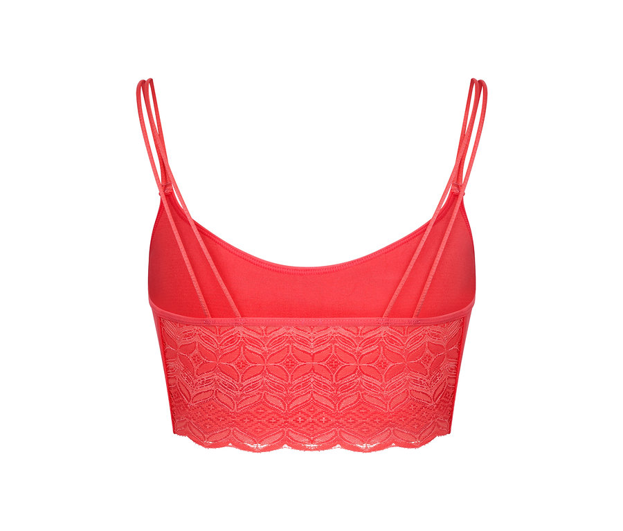 Gros plan sur une brassière corail sans coutures avec de la dentelle, vue de dos.