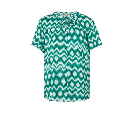 Chemisier-tunique blanc avec un motif vert.