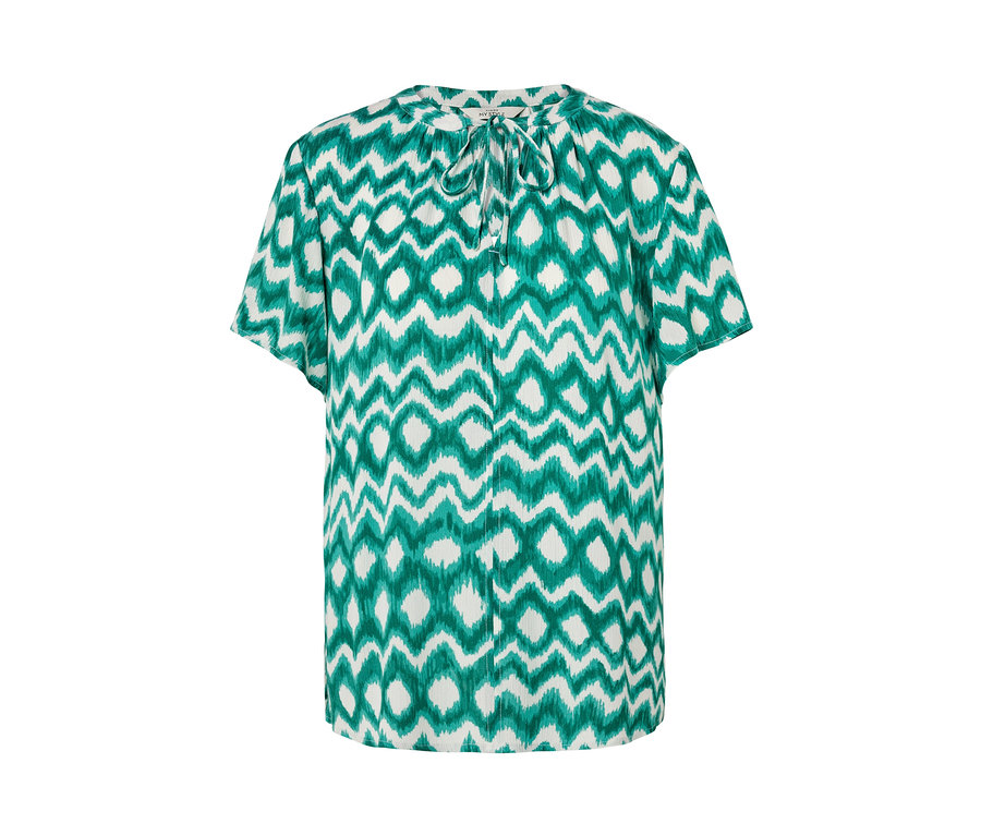 Chemisier-tunique blanc avec un motif vert.