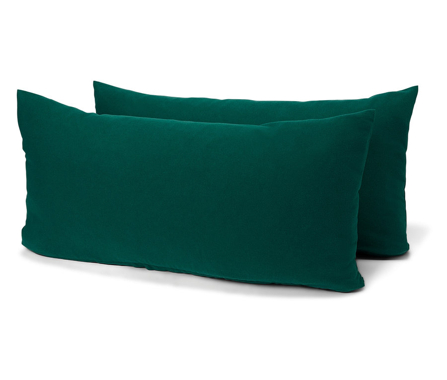 Deux coussins rectangulaires vert émeraude sur fond blanc.