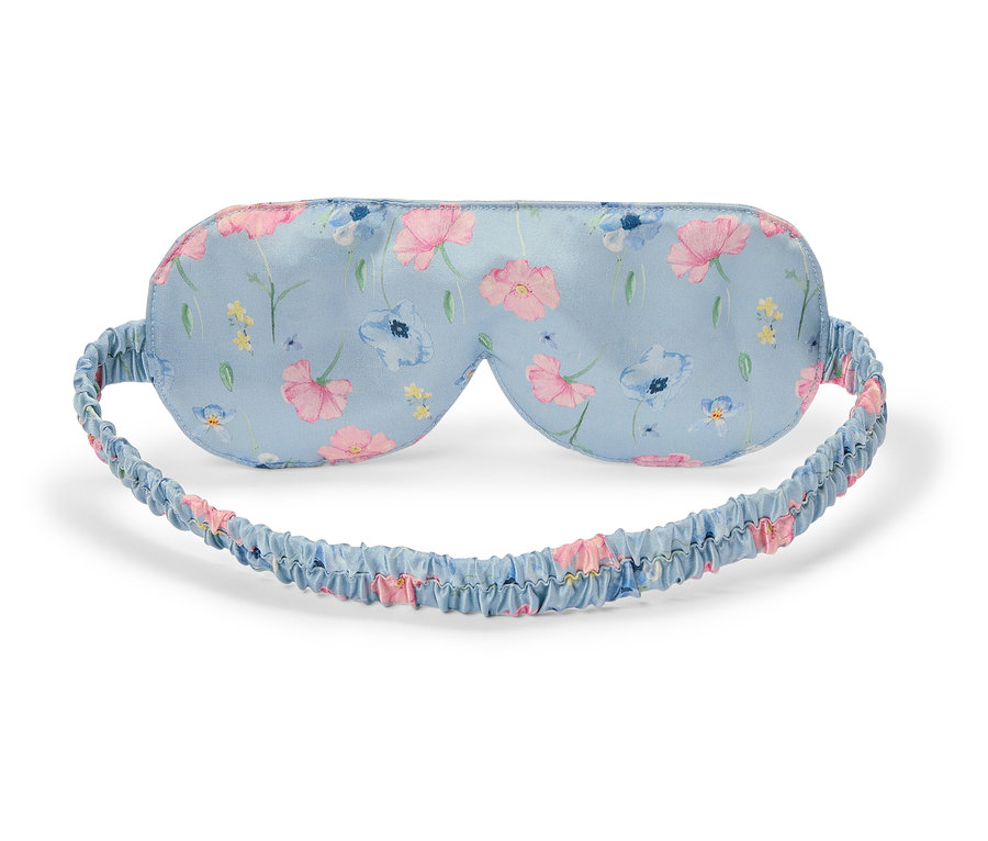 Masque de sommeil bleu clair avec motif floral.