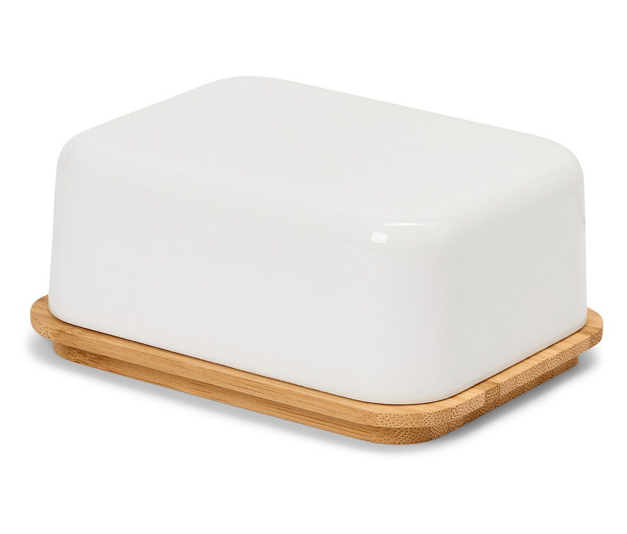 Une beurrier blanche avec un couvercle en bambou sur une surface blanche.