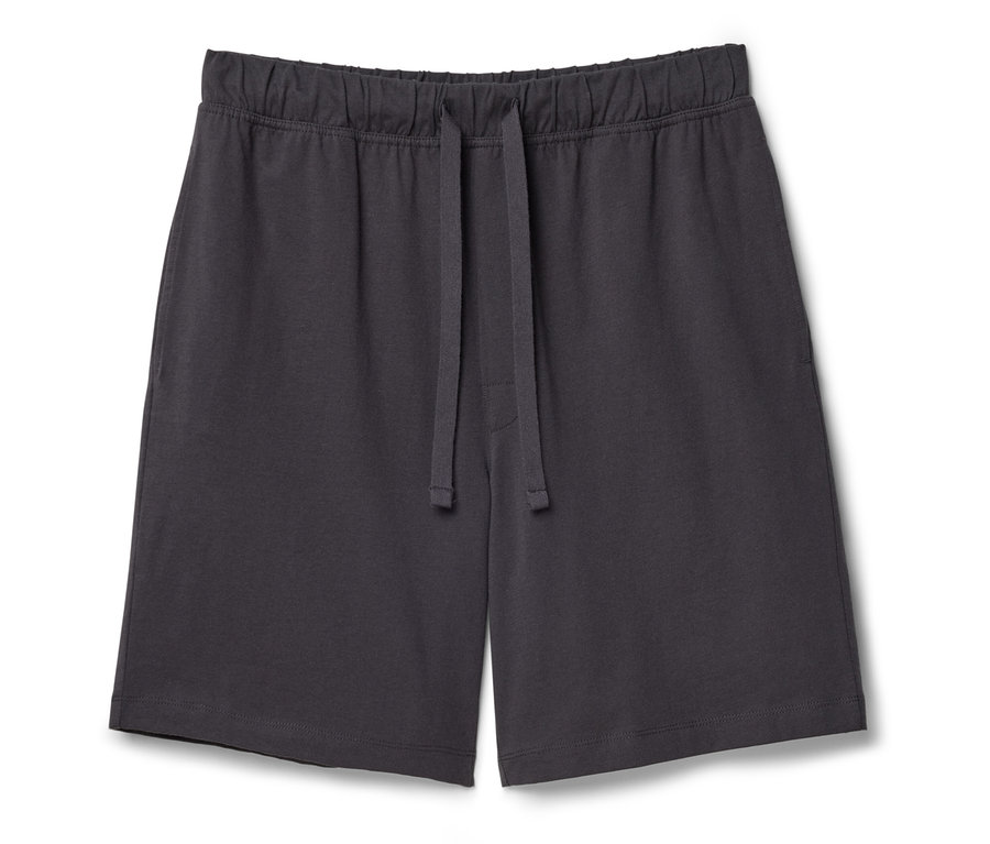 Un short gris foncé avec cordon de serrage posé sur un fond blanc.