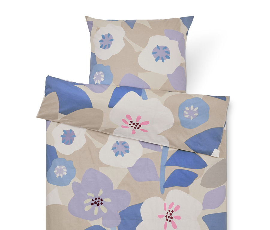 Ensemble de literie à motifs floraux dans les tons beige, violet et bleu, comprenant une taie d'oreiller et une housse de couette.