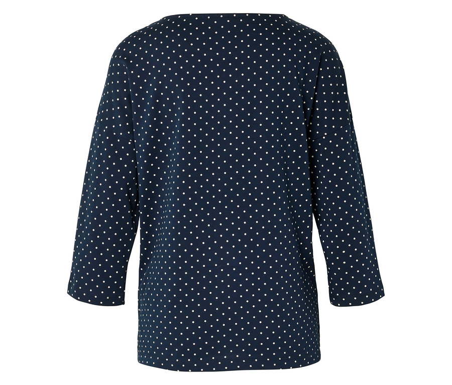 Haut bleu marine à pois blancs.