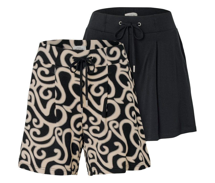 On voit deux shorts, l'un avec un motif tourbillonnant beige sur fond noir et l'autre noir avec un cordon de serrage.