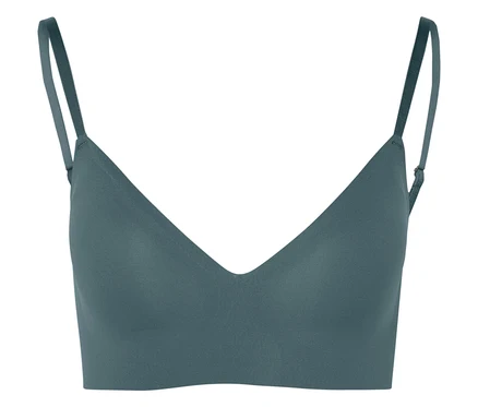 Gros plan d'un soutien-gorge turquoise à fines bretelles.