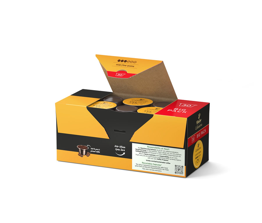 Boîte jaune et noire ouverte contenant des capsules de café.