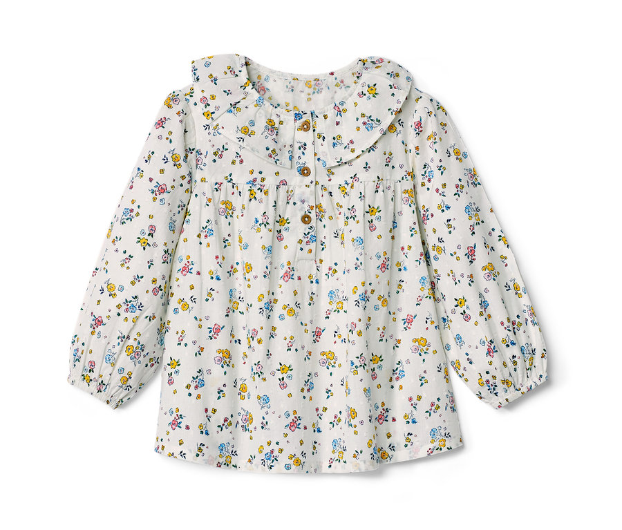 Blouse pour enfant à fleurs avec manches longues et col décoratif.