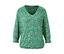 Blouse imprimée verte à manches longues.