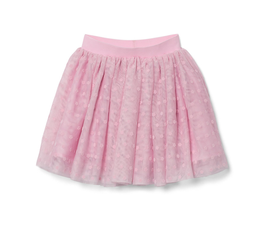 Une jupe en tulle rose pour enfant est posée.