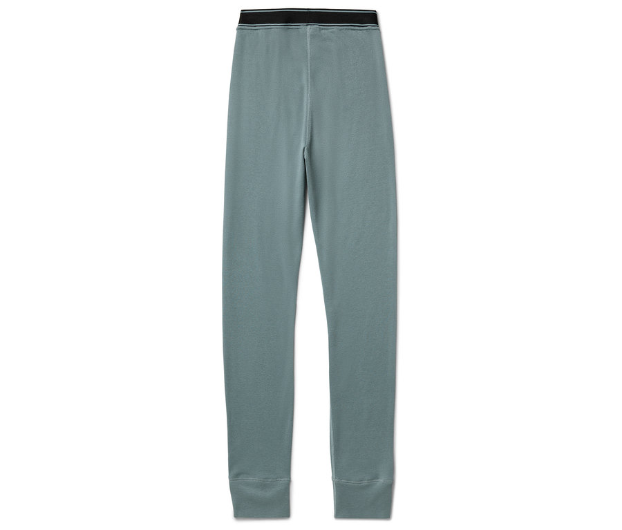 Un legging bleu avec une ceinture noire posé sur un fond blanc.