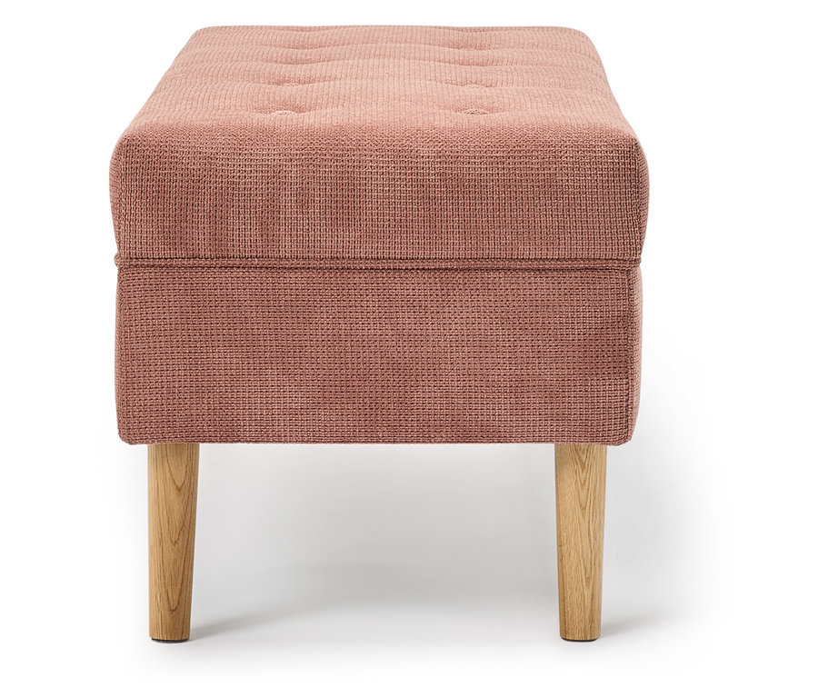 Repose-pieds en tissu rose avec pieds en bois.