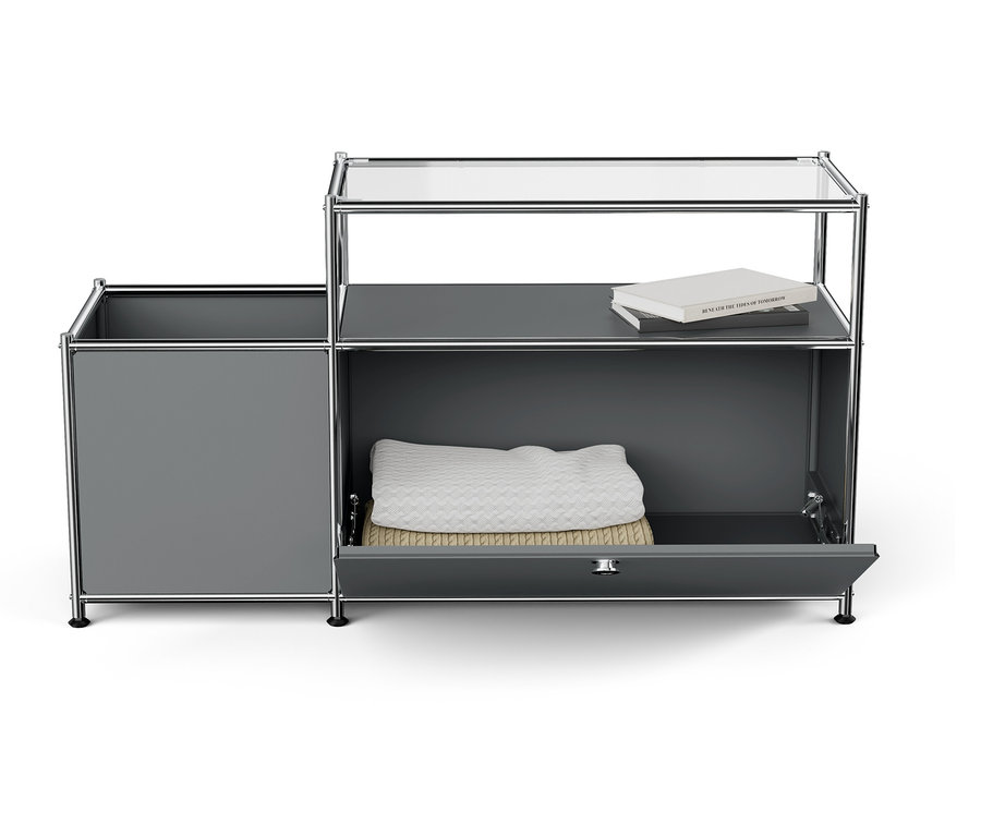 Armoire grise avec tiroir ouvert, couverture blanche et livre sur le dessus.