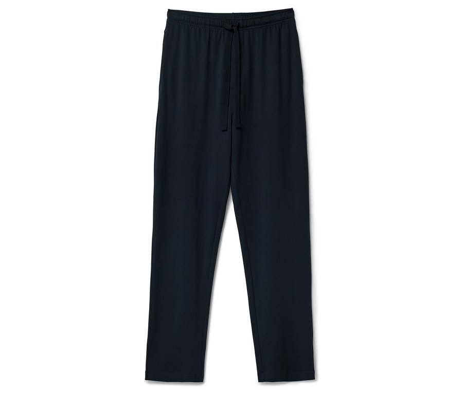 Un pantalon de survêtement bleu marine avec cordon de serrage posé sur un fond blanc.