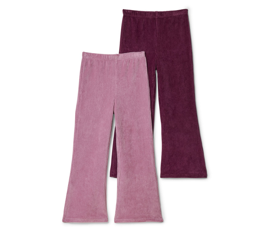 Deux pantalons en velours côtelé évasés, un rose et un bordeaux, sont placés côte à côte sur un fond blanc.