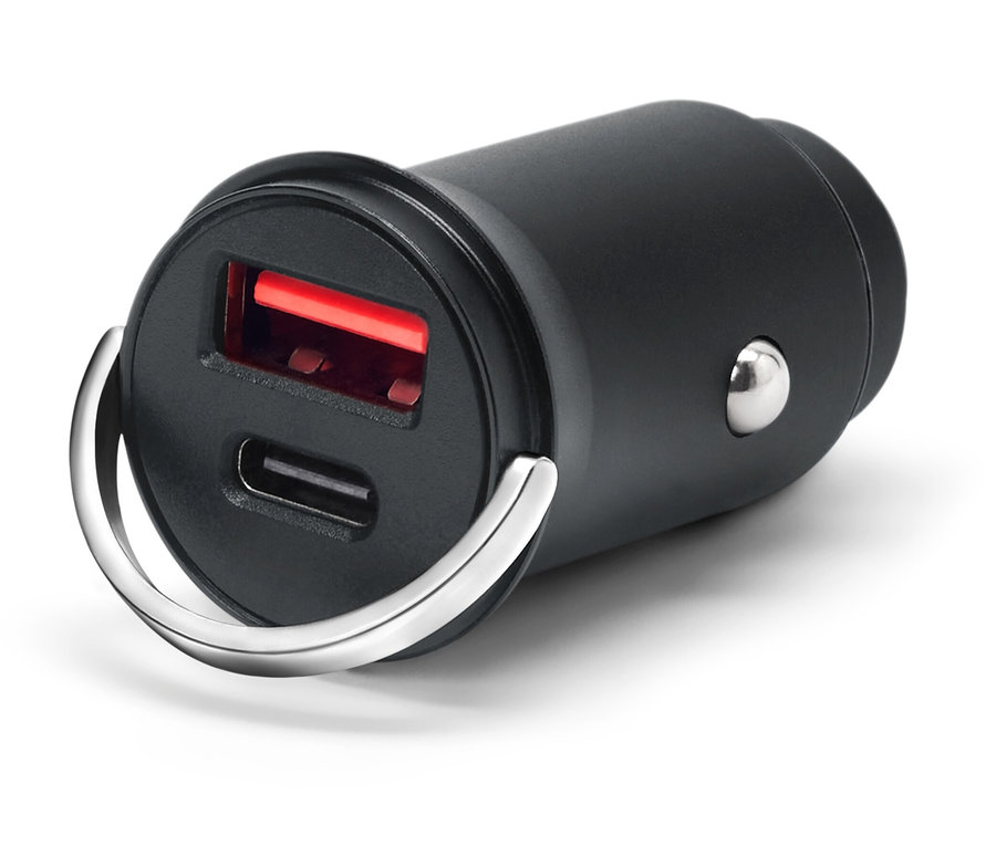 Chargeur USB noir avec deux ports et un anneau argenté sur fond blanc.