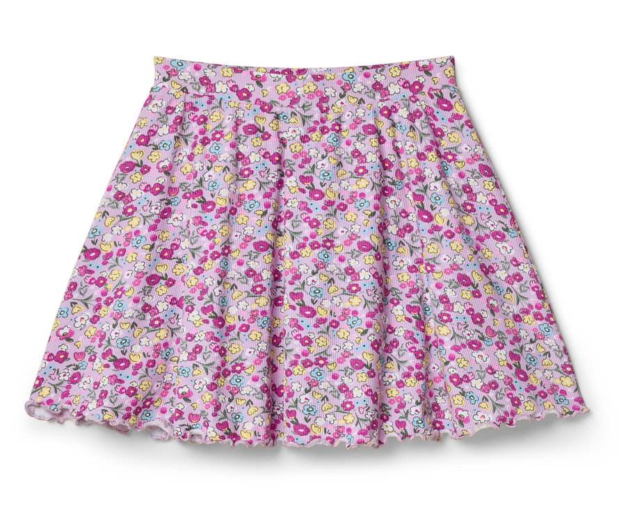 Une jupe évasée à motif floral rose est posée sur un fond blanc.