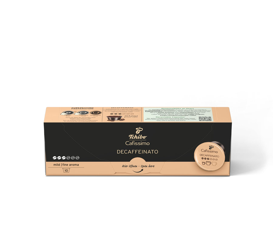 Un paquet de capsules Tchibo Cafissimo Decaffeinato avec l'inscription "Hier öffnen Open here".