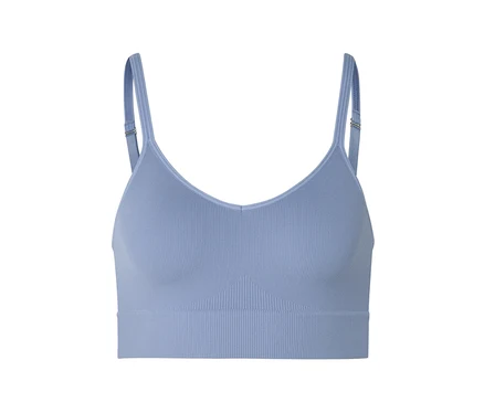Soutien-gorge de sport bleu clair côtelé avec bretelles réglables sur fond blanc.