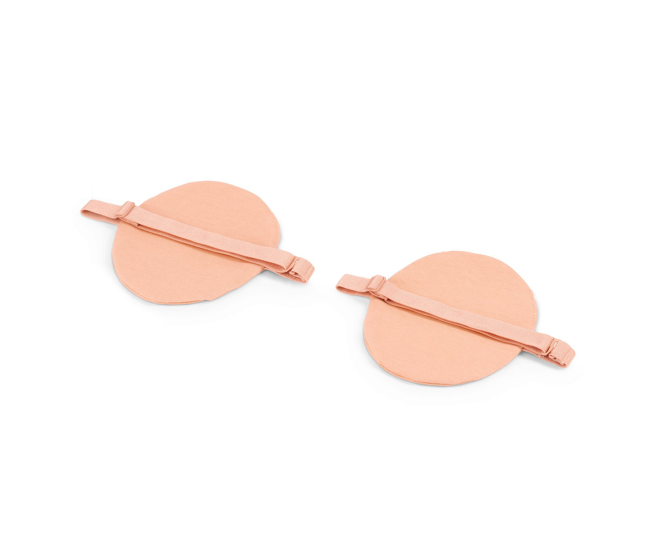 Deux paires de coussinets d'aisselle beiges.