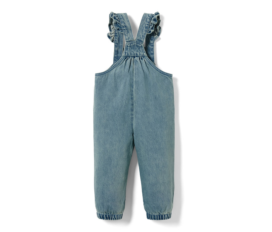 Salopette en denim bleu avec des volants sur les bretelles.
