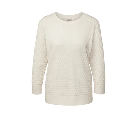 Pull-over en maille structurée de couleur crème.