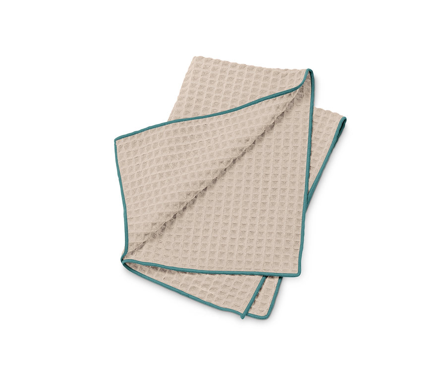Chiffon de séchage spécial beige avec bordure turquoise.