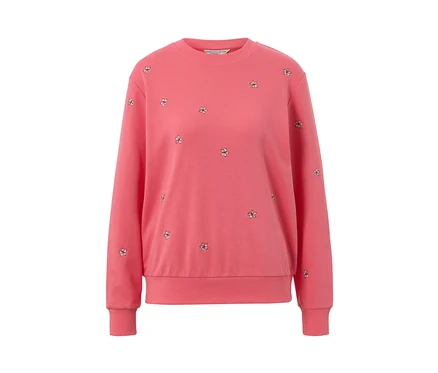 Un sweat-shirt brodé rose.