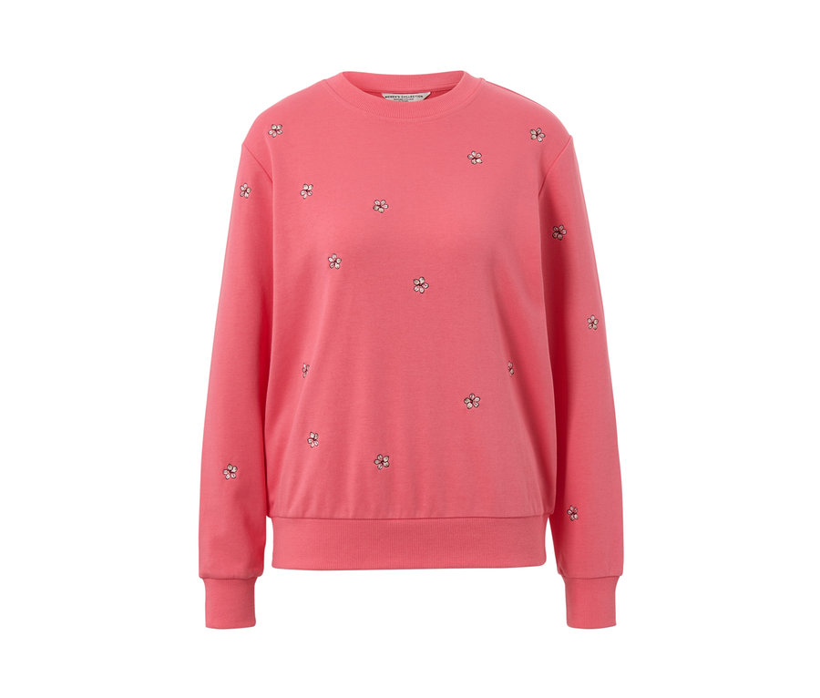 Un sweat-shirt brodé rose.
