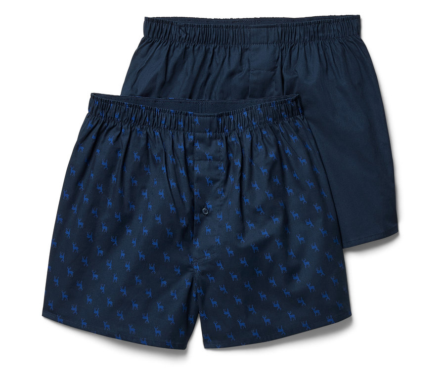 Deux boxers bleus pour hommes avec un motif de rennes bleu clair.