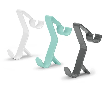 Trois supports de téléphone en blanc, turquoise et gris.