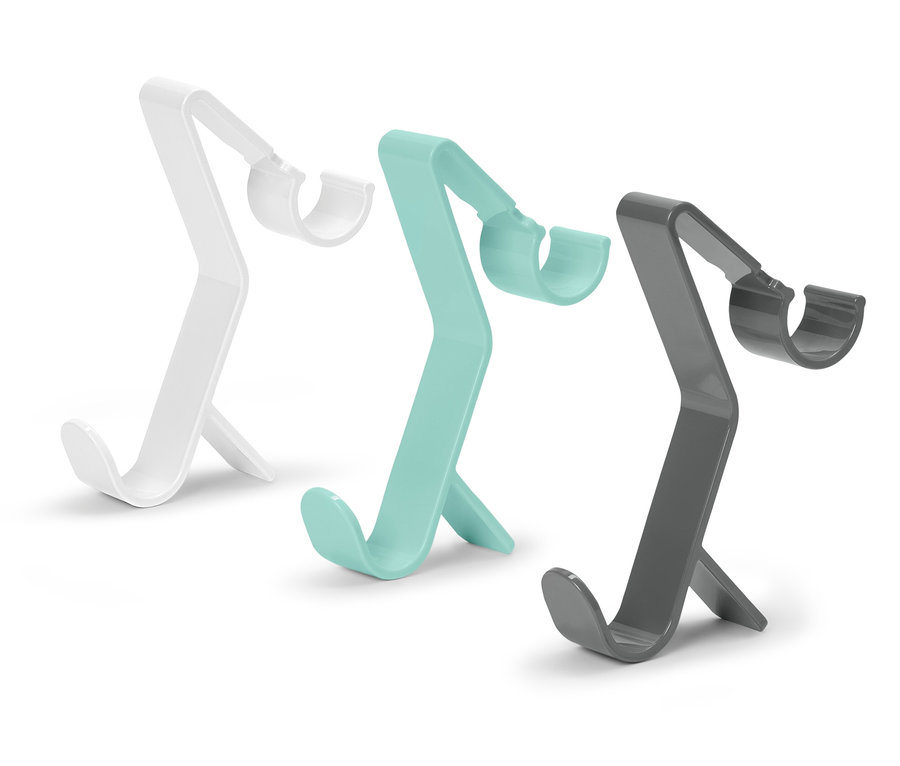 Trois supports de téléphone en blanc, turquoise et gris.