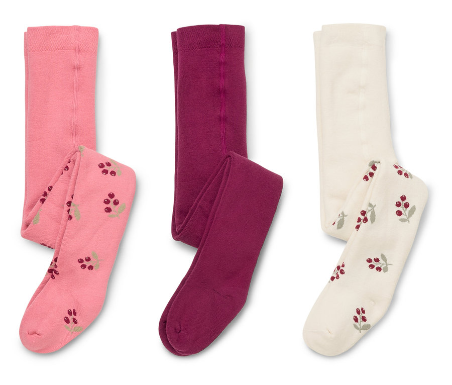Trois paires de collants sont posées sur un fond blanc : une rose à motifs de baies, une bordeaux et une crème à motifs de baies.