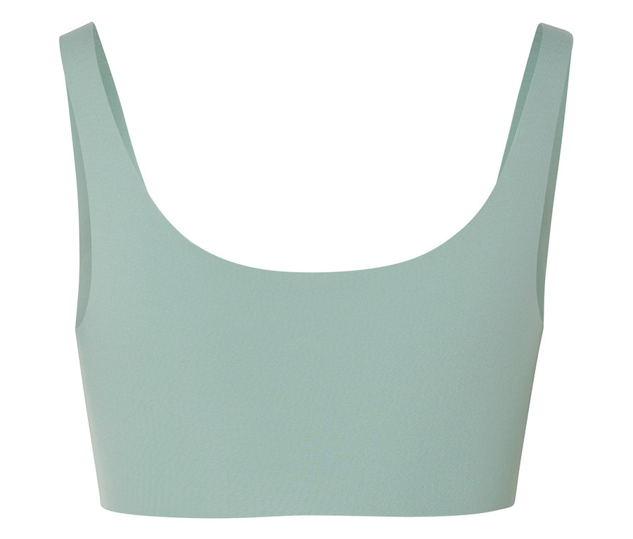 Une brassière de sport vert clair avec de larges bretelles.