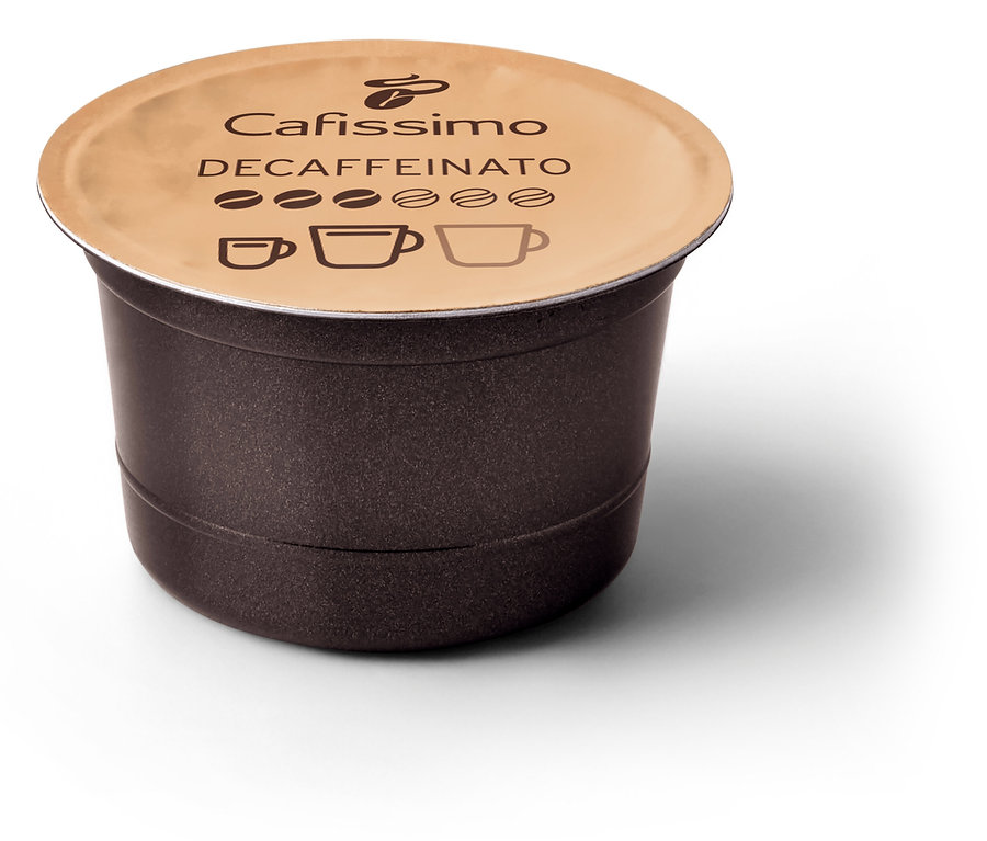 Gros plan sur une capsule de café Cafissimo Decaffeinato brune avec un couvercle beige sur un fond blanc.