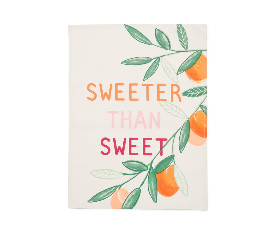 Un torchon avec l'inscription 'Plus doux que doux' et une illustration d'oranges.