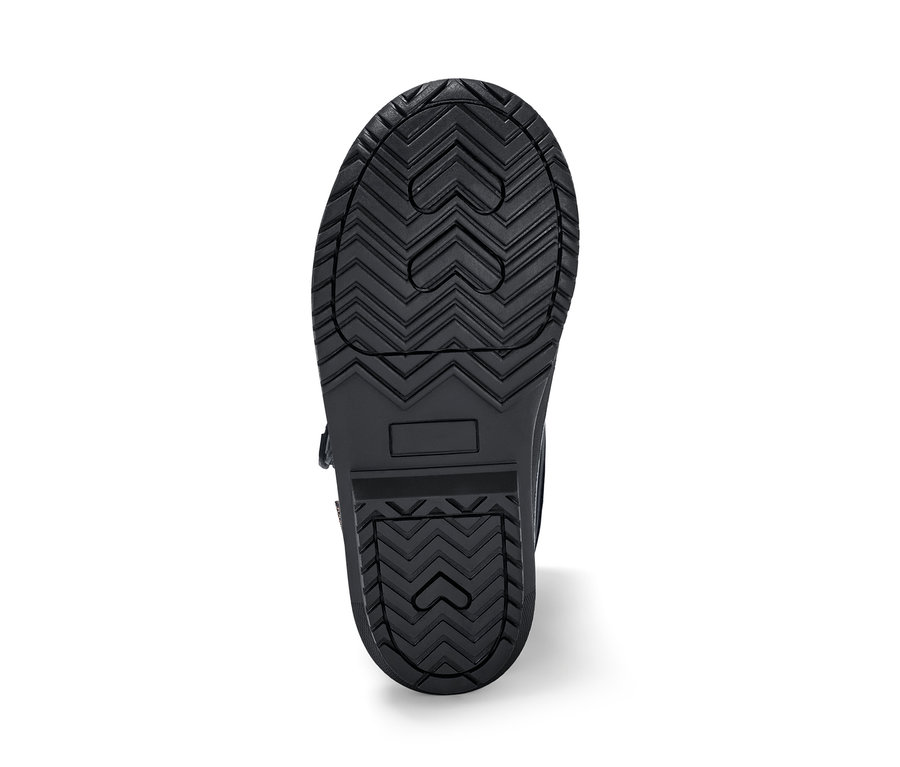 Vue détaillée de la semelle d'une botte noire polyvalente pour enfant.