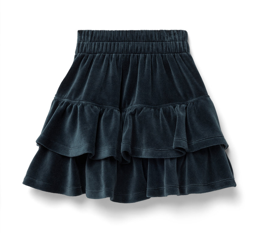 Une jupe bleu marine en velours avec une taille élastique et deux volants.