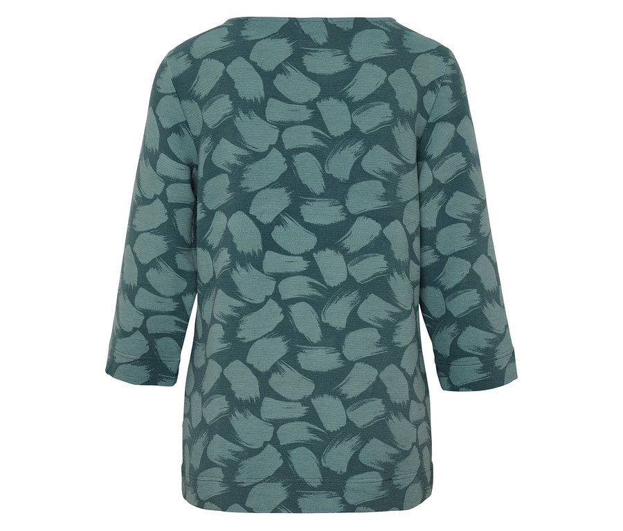 Vue arrière d'un chemisier bleu-vert avec un motif de coups de pinceau.