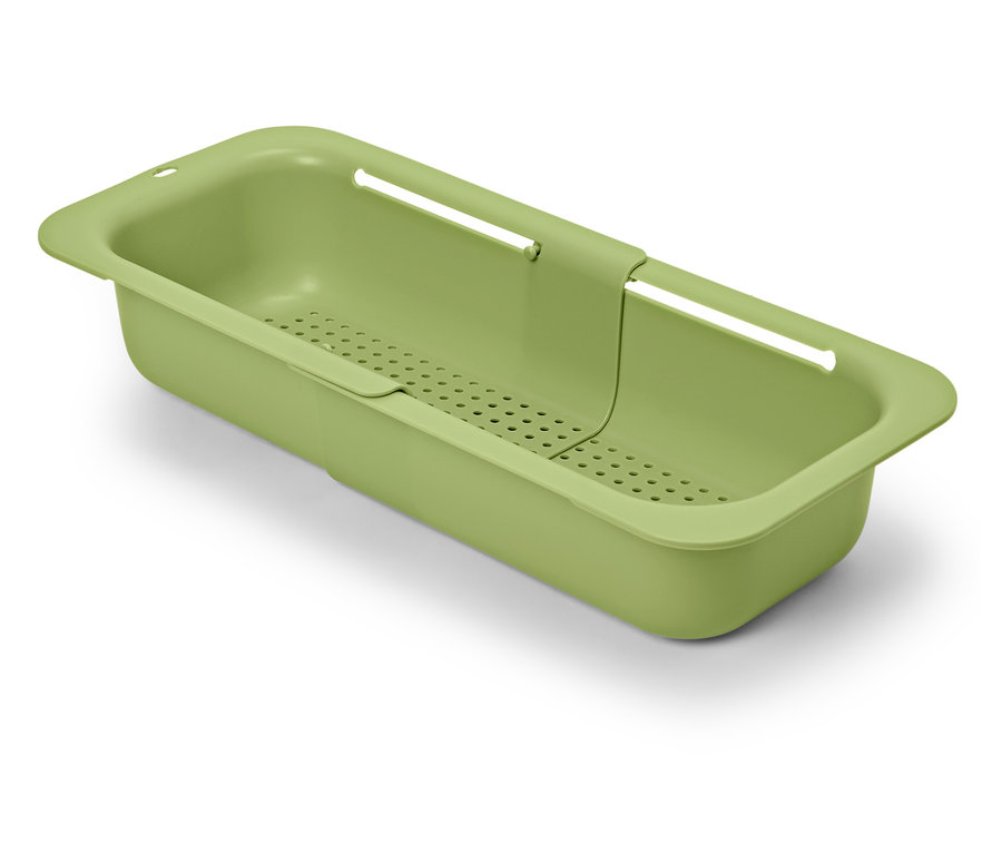 Passoire d'évier extensible verte sur fond blanc.