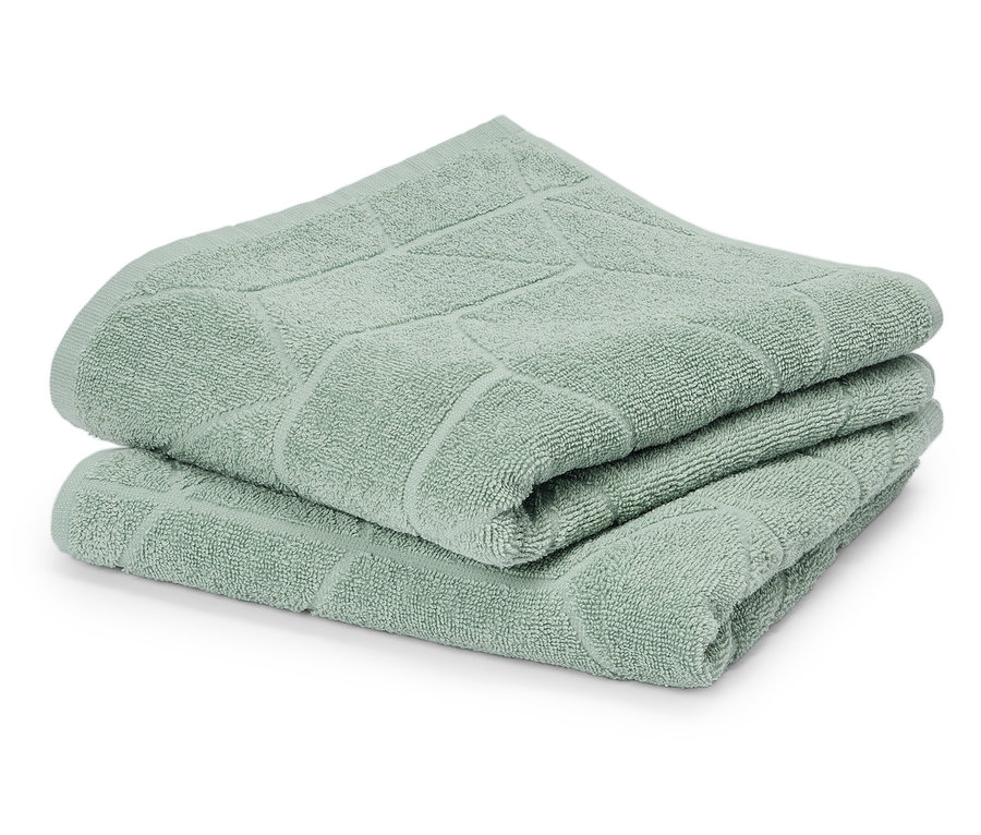 Pile de deux serviettes vert menthe avec motif géométrique.